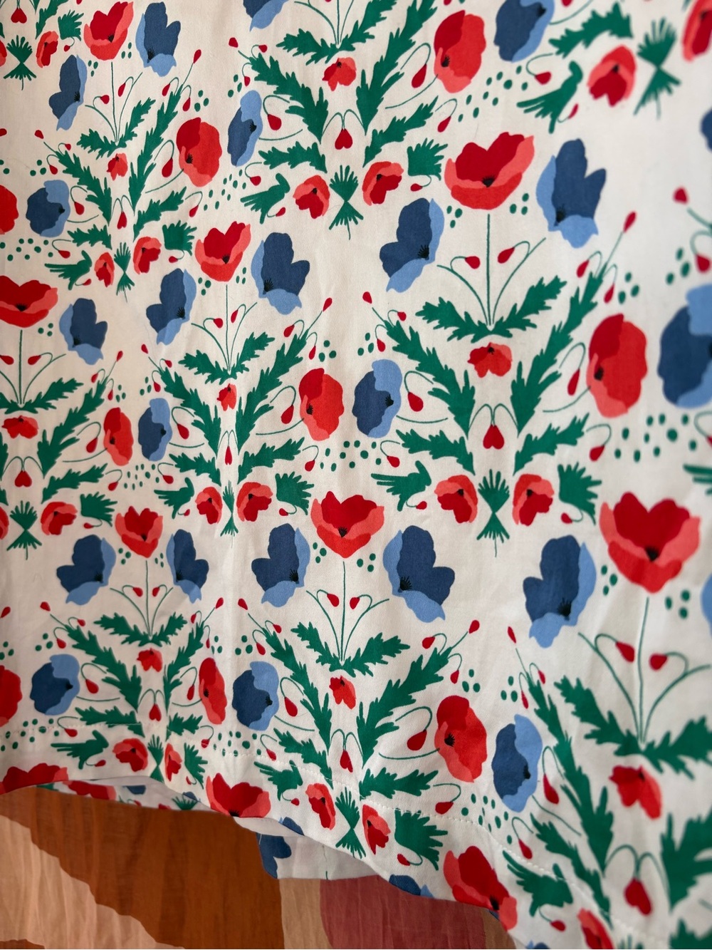 Emily McCarthy Floral Popover Blouse in White with Red & Blue Print - Picture 3 of 5